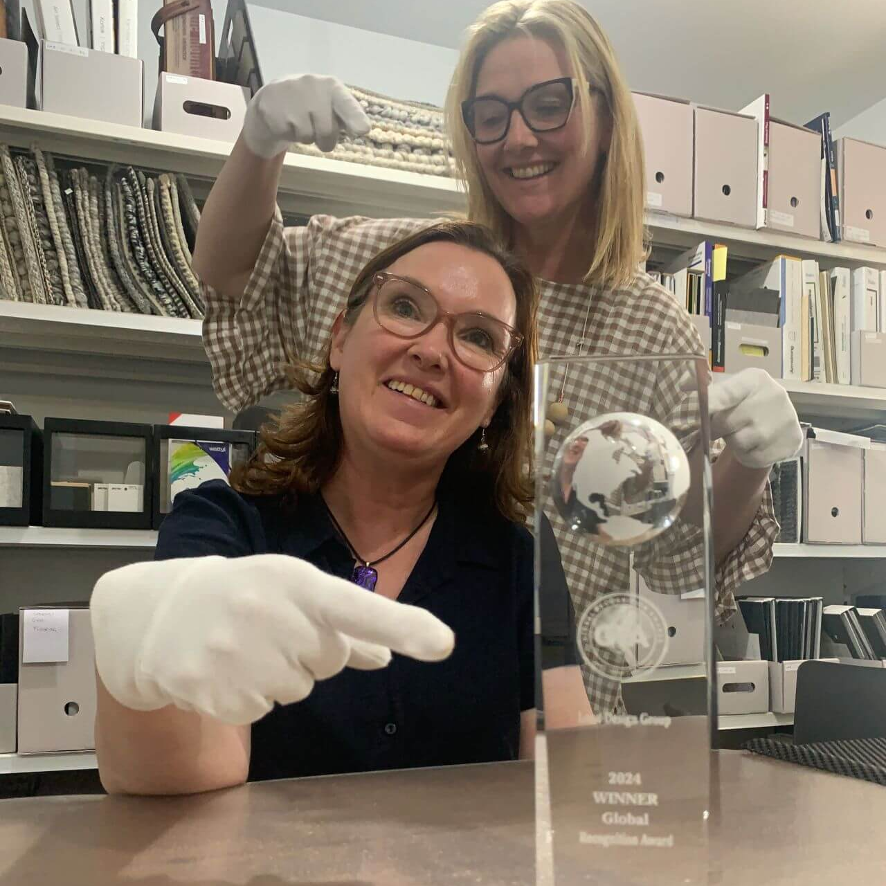 Photograph of Angela Dobson-Block and Lousie Dobson Trease showing off their trophy for the Global Recognition Awards Photograph of Angela Dobson-Block and Lousie Dobson Trease showing off their trophy for the Global Recognition Awards