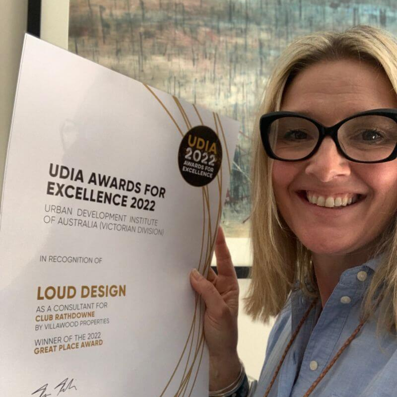 Photograph of Louisewith her UDIA Great Place award